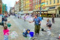 Street entertainer Ã¢â¬â playing with children, making soap bubbles